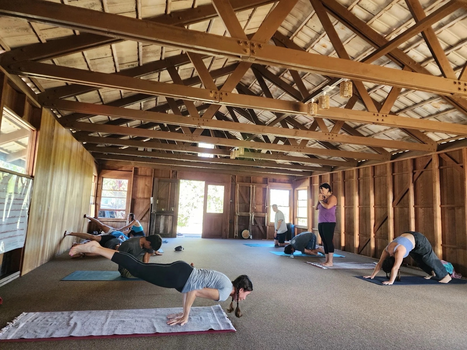 Interior of the wooden practice hall at House of Yoga and Zen